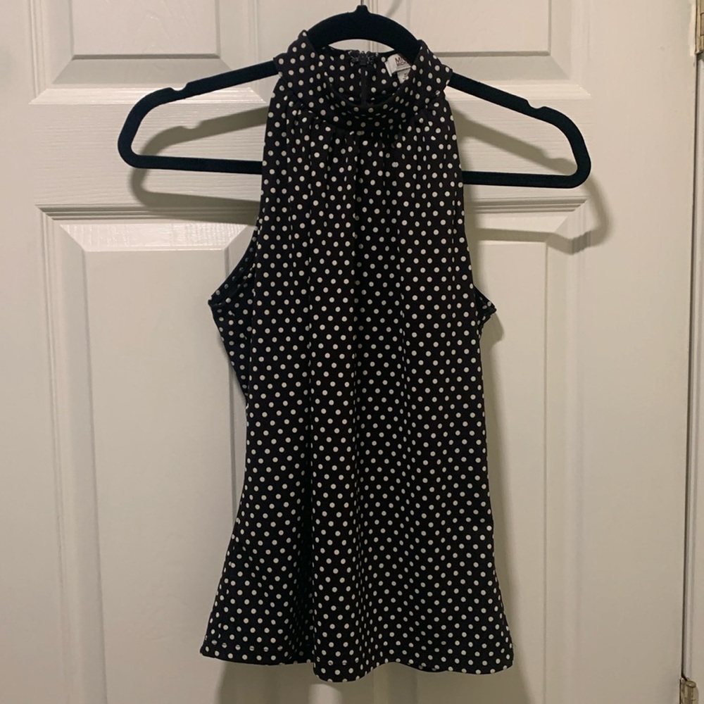 Michael Kors, polkadot top, shows off those beautiful shoulders